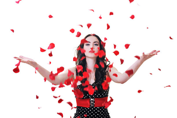 istock young woman with falling rose petals 152130839