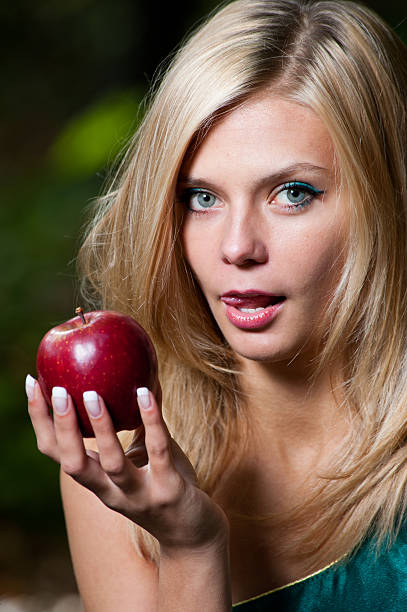 istock Young girl eating an apple 152131494