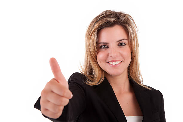 Business woman showing thumb up stock photo