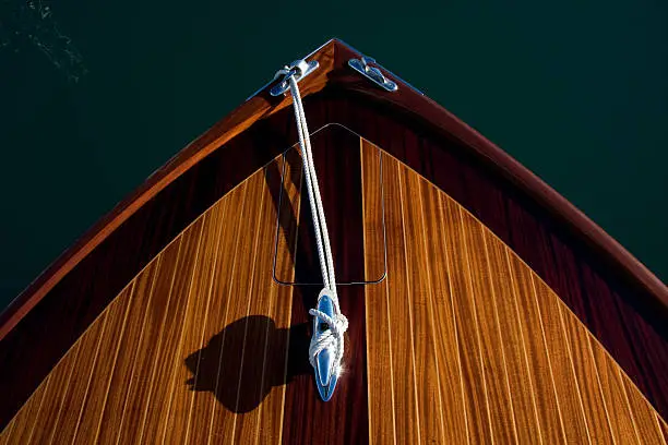 Bow of classic varnished motor yacht