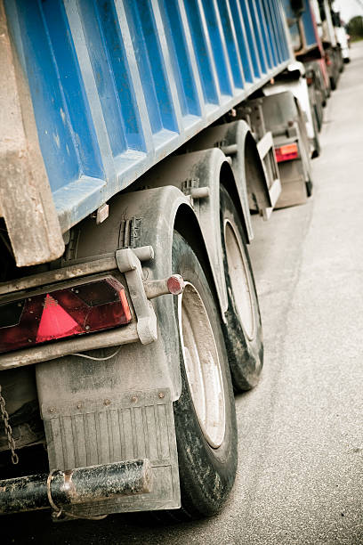 istock Dirty trucks stand in line from behind 152133064