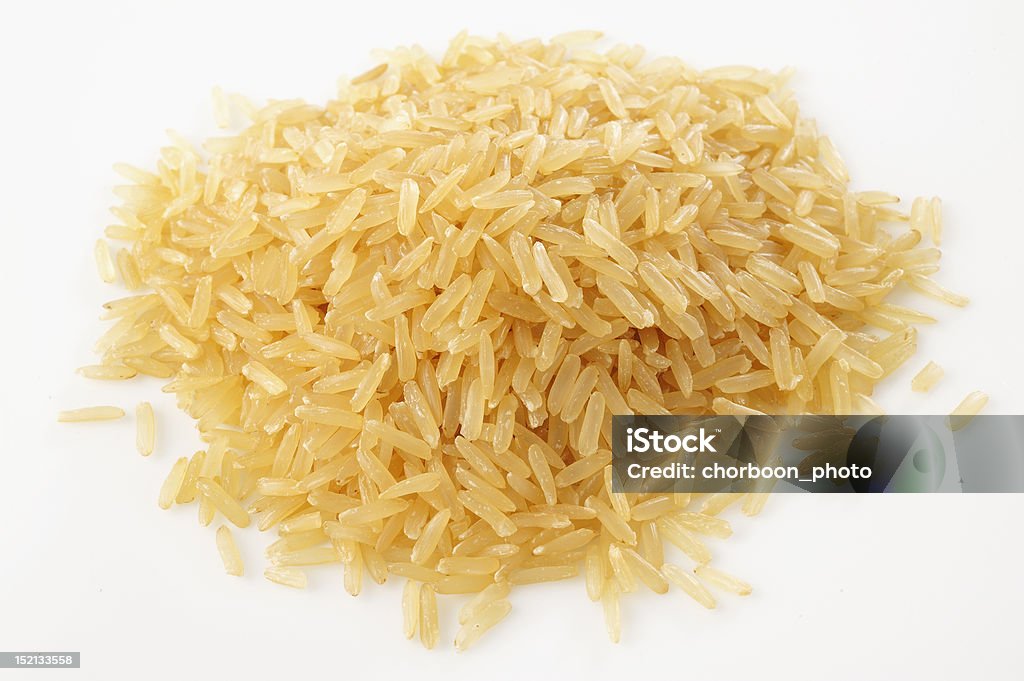 Brown rice on white background Backgrounds Stock Photo
