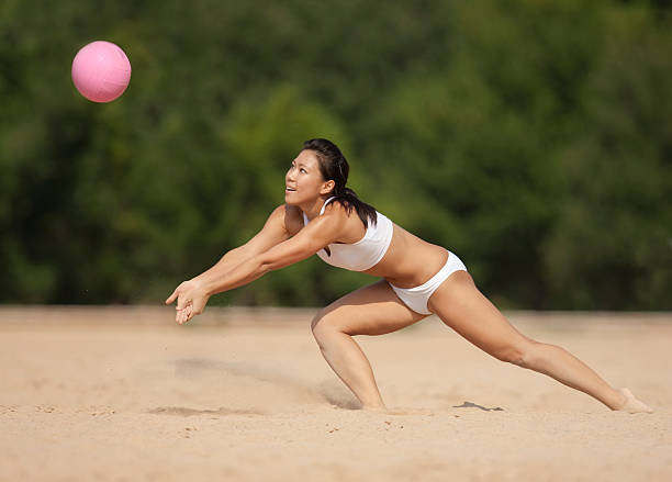 istock Ethnic Female Playing Sand Volleyball 152133702