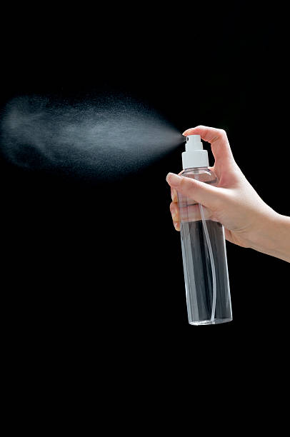 istock Female Hand Grabbing Transparent Spray Bottle 152134229