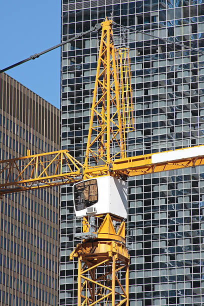 istock Tall crane in city center 152134342