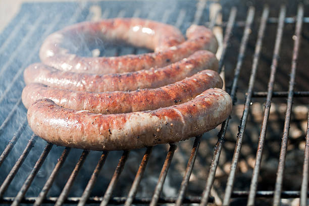 istock Five pork sausages on a grill 152134423