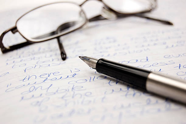 Pen and glasses stock photo