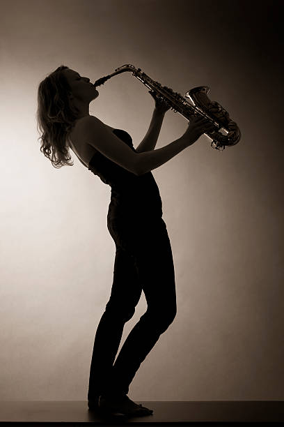 istock Woman playing saxophone, sepia toned. 152135002