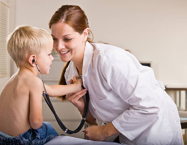 istock Doctor giving boy checkup in an exam room 152135089