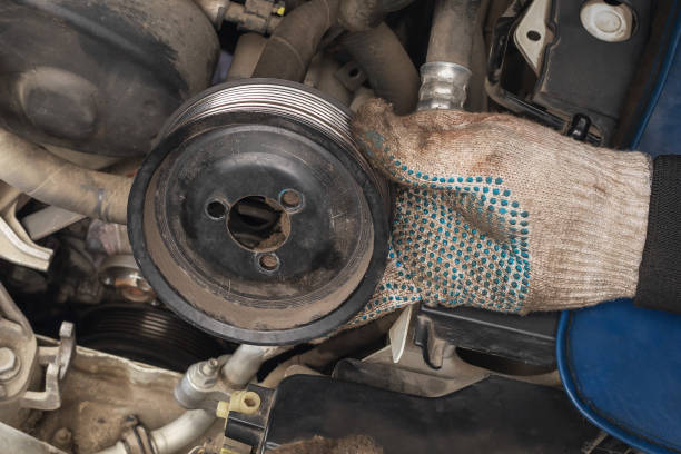 istock An auto mechanic removed an old pulley from a car engine to replace it with a new one 1521354375