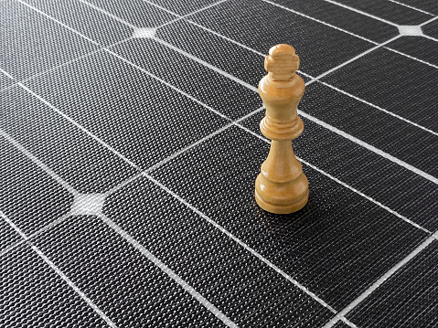 Chess king on a solar cell panel