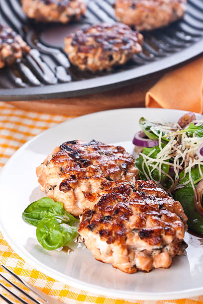 istock Fish cutlet with a salad of spinach and onion 152136029