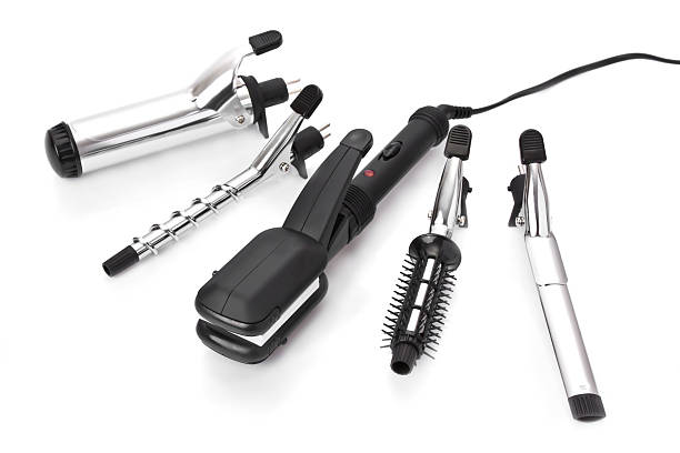 Hair styling set with straighteners & curling accessories Hair styling set with straightener and curling accessories curling tongs photos stock pictures, royalty-free photos & images