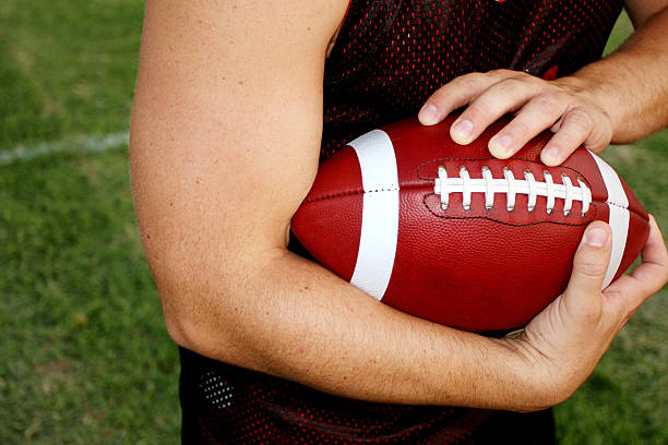 istock Running back carrying American football 152136446