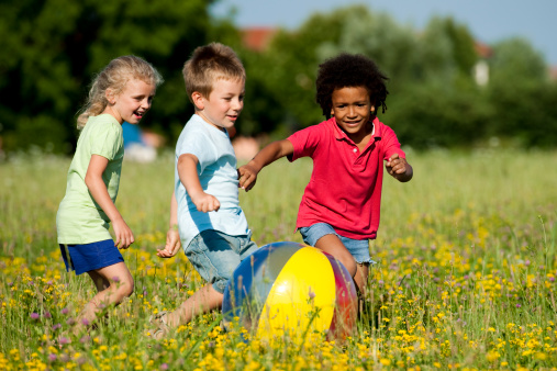 Multi-ethnic children playing ball