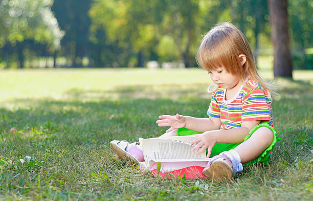 child with book stock photo