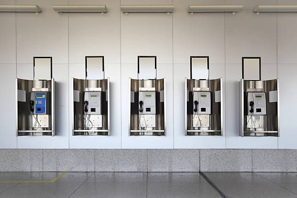 istock Many public phones in big hall with white walls 152136813
