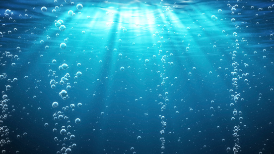 Olas del océano azul bajo el agua con burbujas photo