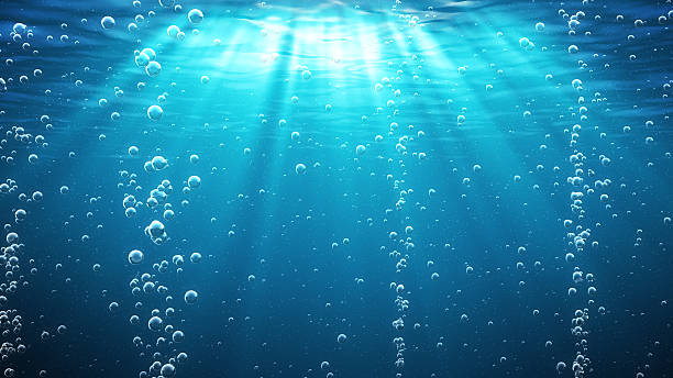 ブルーの大洋の波の水中に泡 - 水中 ストックフォトと画像