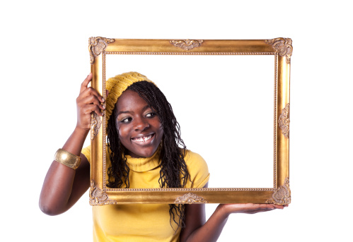 young beautiful african woman inside an antique picture frame (isolated on white)