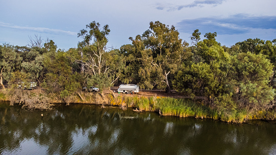 Aerial view camping in a caravan on the banks of the Murray River at Bruce's Bend in Mildura, Victoria, caravan on the side of a freshwater river, R V camping on the banks of the Murray River, Mildura, Victoria,