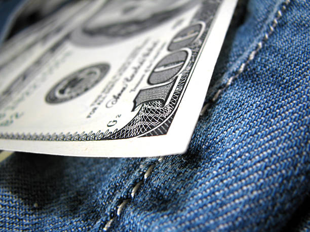 Money in pocket stock photo