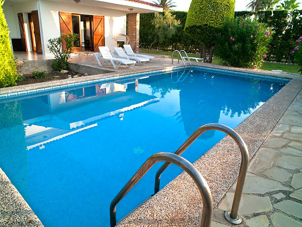 Summer villa with in-ground pool and landscaped deck Vacation home in the Costa Dorada, Tarragona province, Catalonia, Spain. pool gate stock pictures, royalty-free photos & images