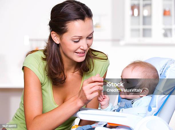 Mother Feeding Hungry Baby Stock Photo - Download Image Now - Baby - Human Age, Breakfast, Care