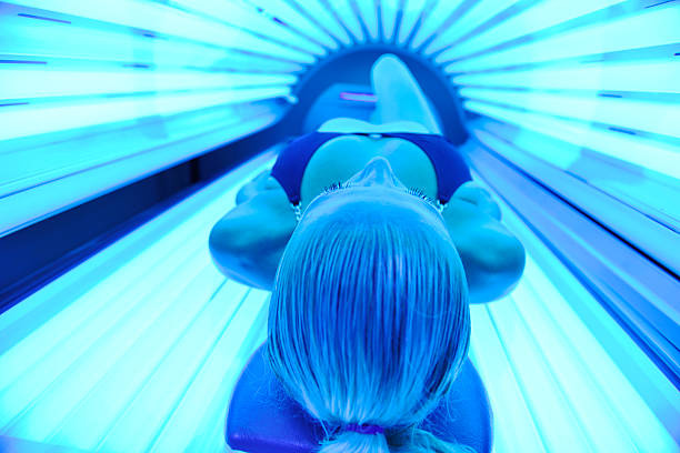 solarium treatment beautiful young woman at spa and wellness back massage treatment tanning bed stock pictures, royalty-free photos & images