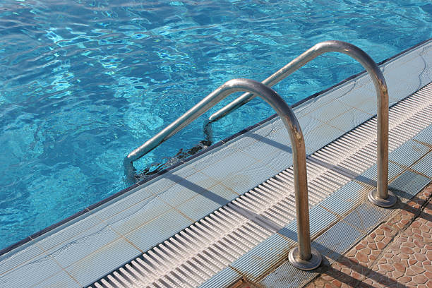 istock Swimming-pool water with ladder 152141659
