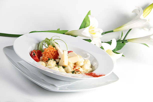 istock Italian pasta with cheese and flowers in the background 152141952