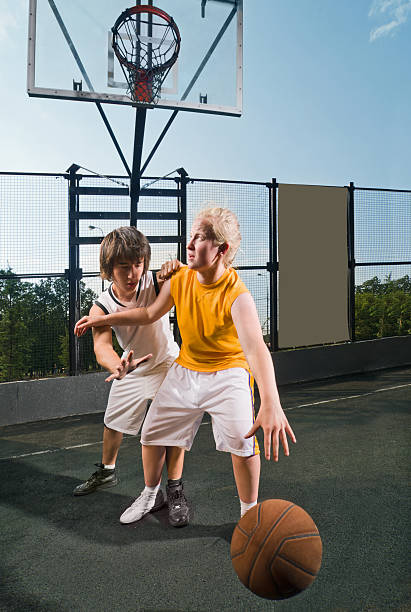 istock Two teenage players with basketball 152142000
