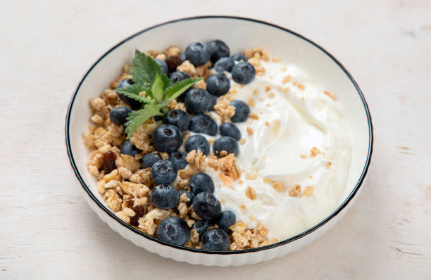 istock Healthy breakfast, cereal with berries and yogurt. 1521423451
