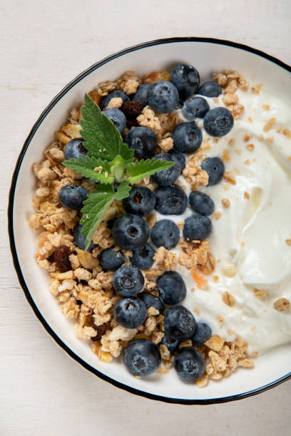 istock Healthy breakfast, cereal with berries and yogurt. 1521433881