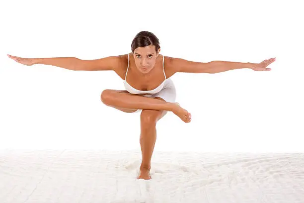 Photo of yoga pose - female in sport clothes performing exercise