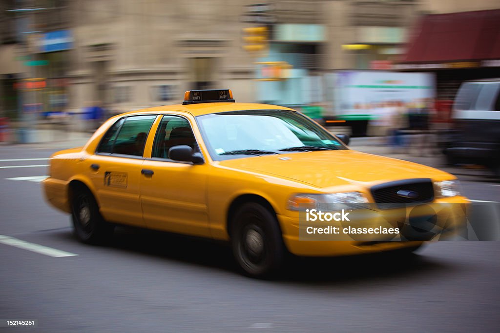 Yellow NY cab New York taxi on Manhattan in high speed with motion blurred background Blurred Motion Stock Photo