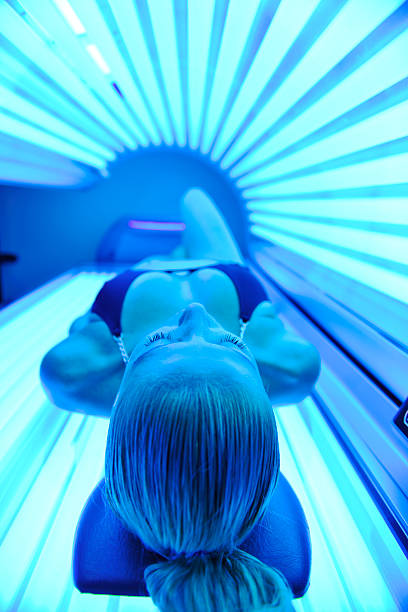istock A woman in a solarium treatment chamber 152146267
