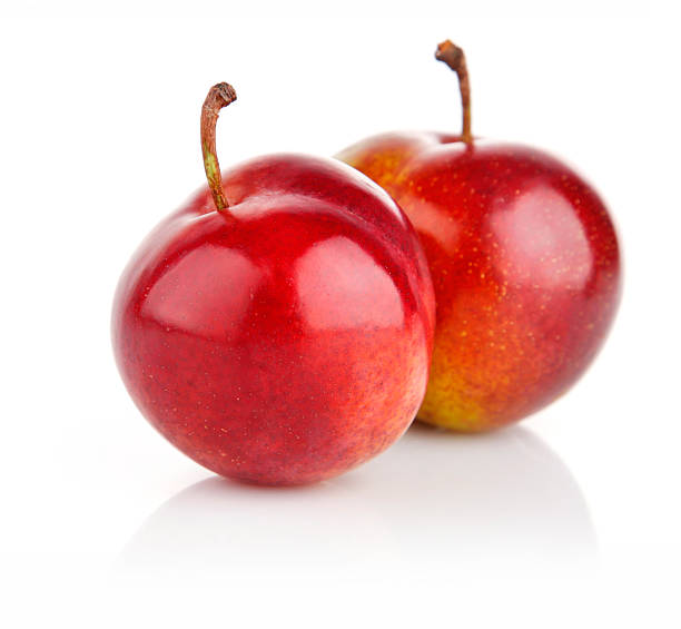 istock fresh plum fruits isolated on white 152148100