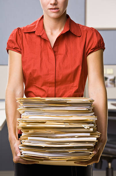 istock Businesswoman Carrying Stack of File Folders 152149087