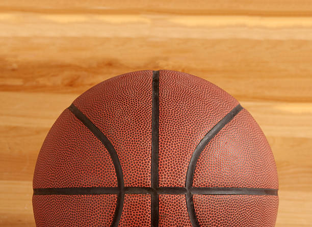 istock Basketball on hardwood court 152149248