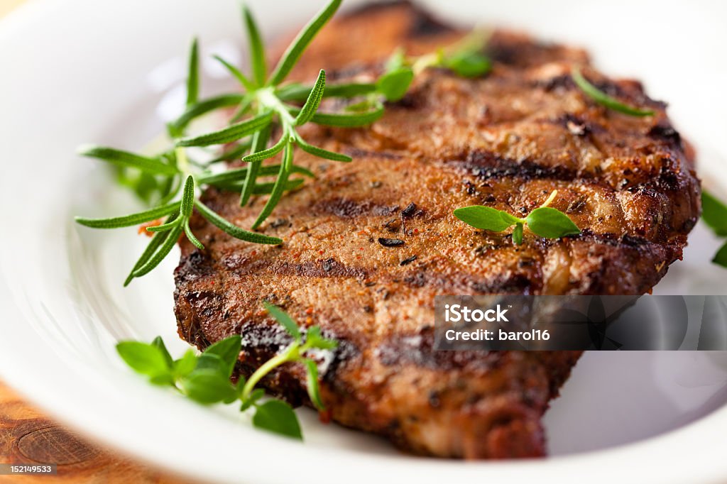 Grilled pork with fresh herbs grilled pork with thyme and rosemary Close-up Stock Photo