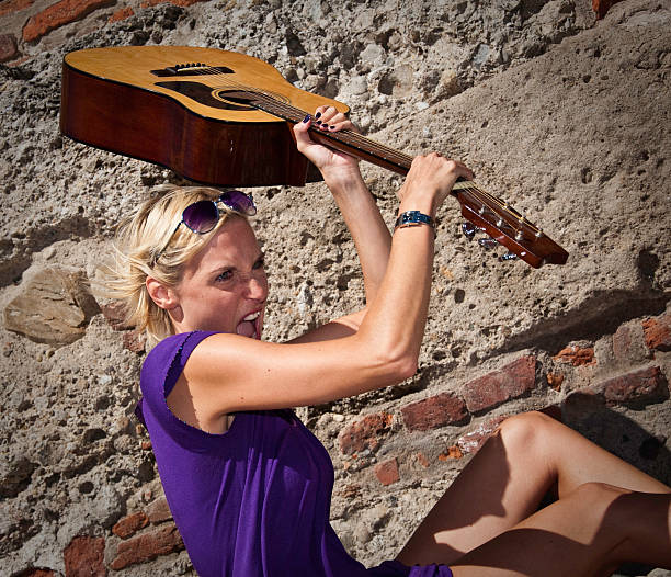 Woman holding a guitar