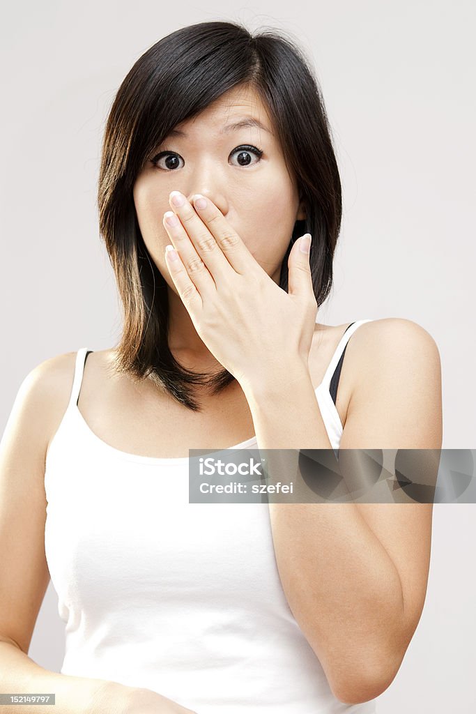 Unbelievable Shocked woman covering her mouth by hand. Hands Covering Mouth Stock Photo