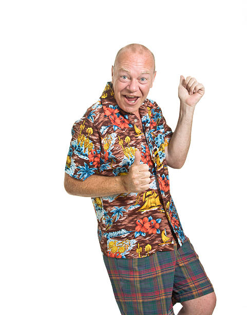 Happy male senior in brightly colored shirt and shorts stock photo