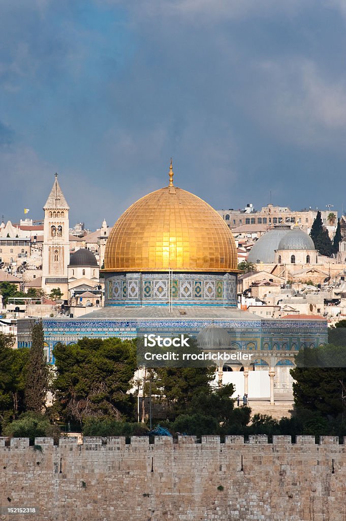 Old City of Jerusalem The morning sun shines on the golden Dome of the Rock and church steeples on the skyline of the Old City of Jerusalem. Ancient Stock Photo