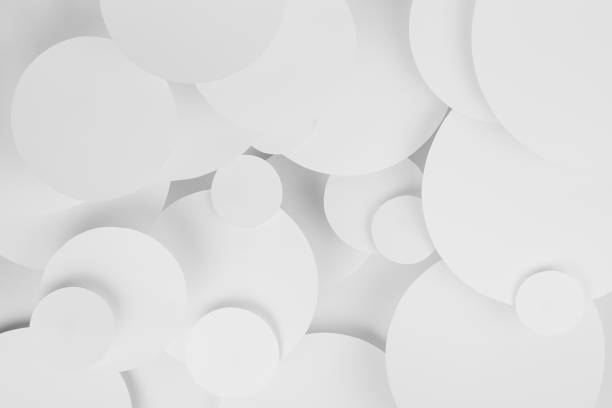 istock White abstract background of soar paper circles pattern of different size, perspective, top view, backdrop for advertising, design, card, poster, flyer, text in elegant soft light minimalistic style. 1521531876