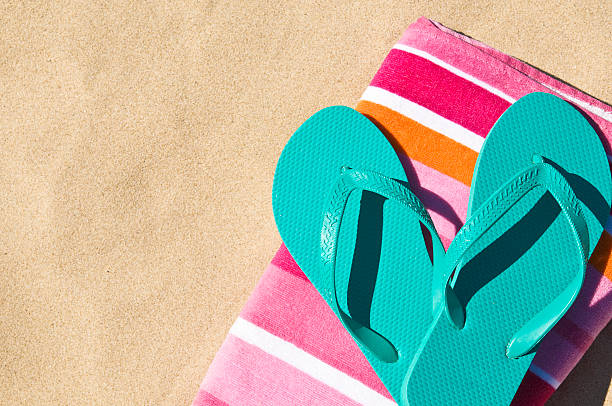 Flip-flops on towel. stock photo