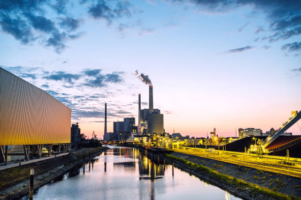 Dusk view of Germany's largest coal-fired power plant near Mannheim.\nLarge power station on the River Rhine at dusk.