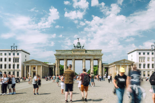 istock Brandenburg Gate, Berlin at daytime, bustling city, blurred motion, lively atmosphere. 1521552661