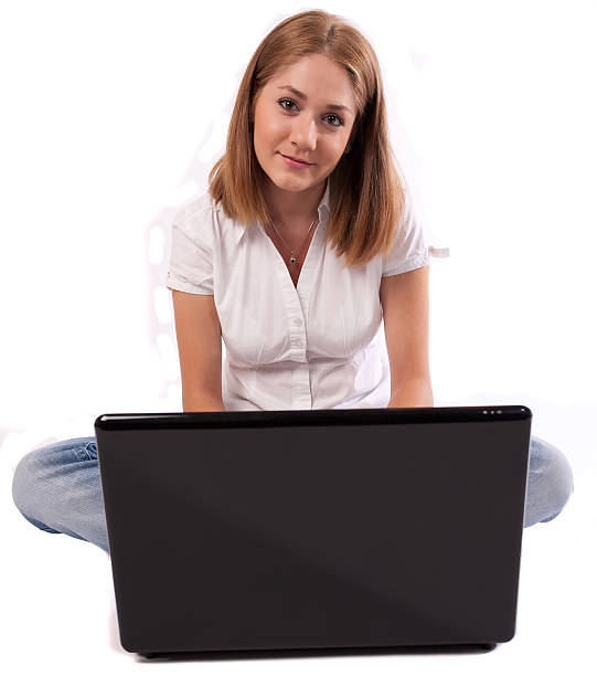 istock Young woman standing in front of a laptop 152157248